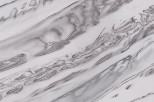 Solid surface countertop in white with bold grey marbled veining